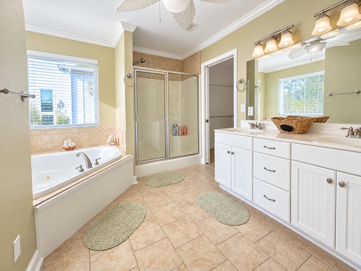 Bathroom with tub, shower, and double vanity