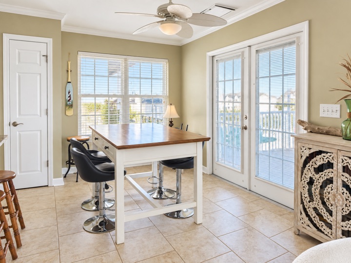 Dining area beside windows and French doors