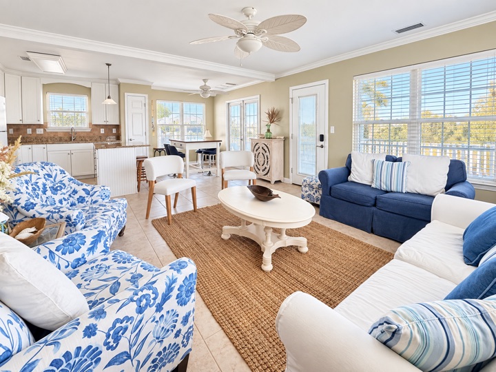 Bright living area with blue and white seating